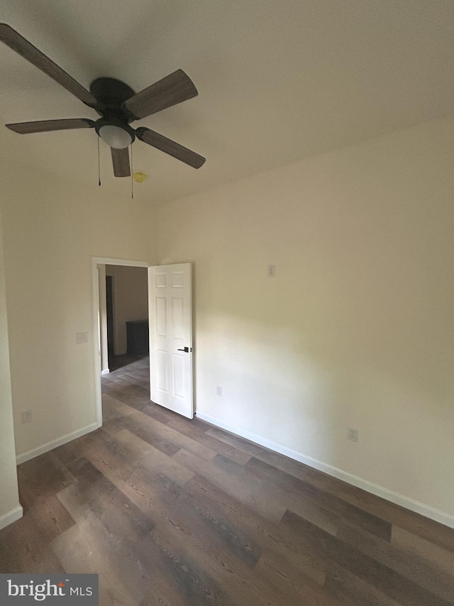 Meadow View Dr, Lost City, WV 26810 - unfurnished room featuring dark wood finished floors, ceiling fan, and baseboards