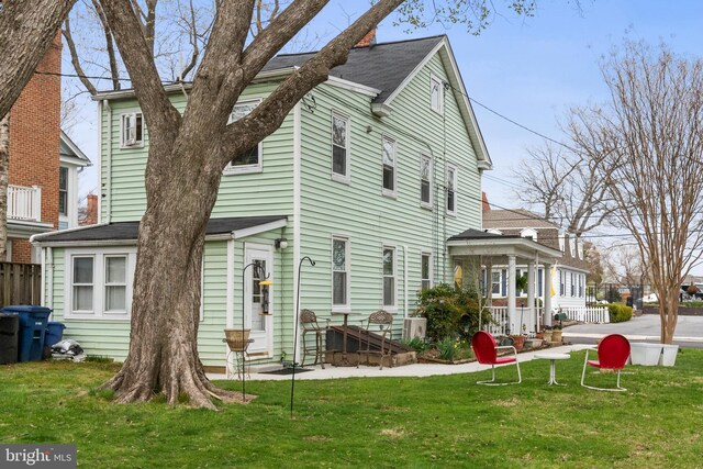 604 6th St, Annapolis, MD 21403 - rear view of property with a lawn