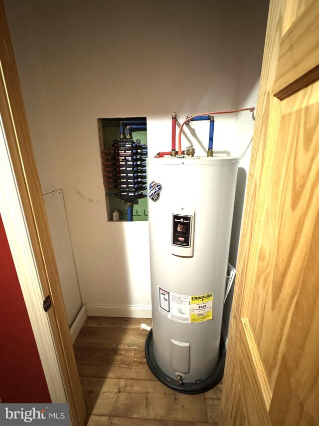utilities with water heater and electric panel