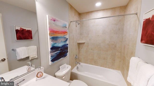 full bath featuring toilet, vanity, and shower / bathtub combination
