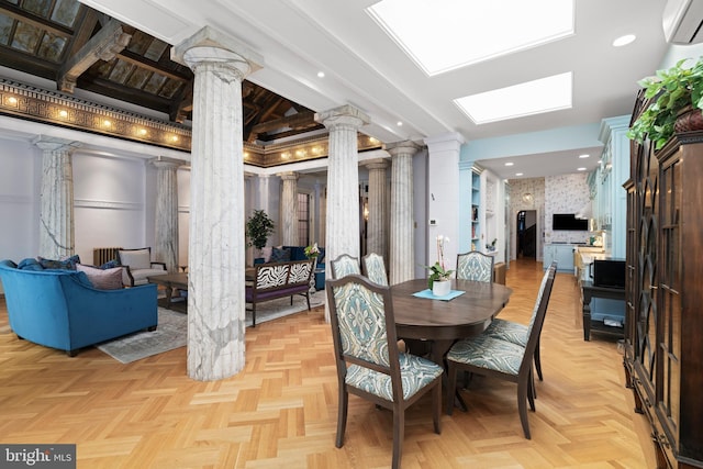 dining space with ornate columns and an AC wall unit
