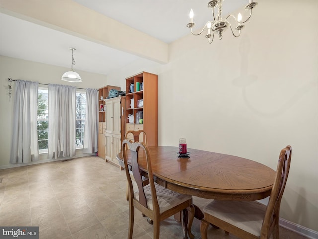 128 Whitman Ln, Inwood, WV 25428 - dining area featuring a notable chandelier and baseboards