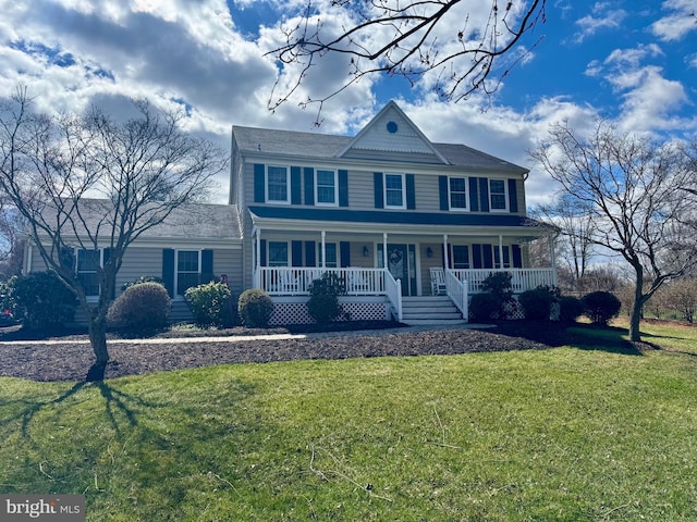 view of front of home featuring a front lawn and a porch
