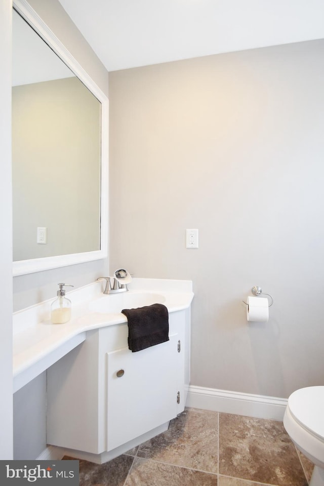 1003 E Cherry St, Palmyra, PA 17078 - half bathroom with tile patterned flooring, toilet, vanity, and baseboards