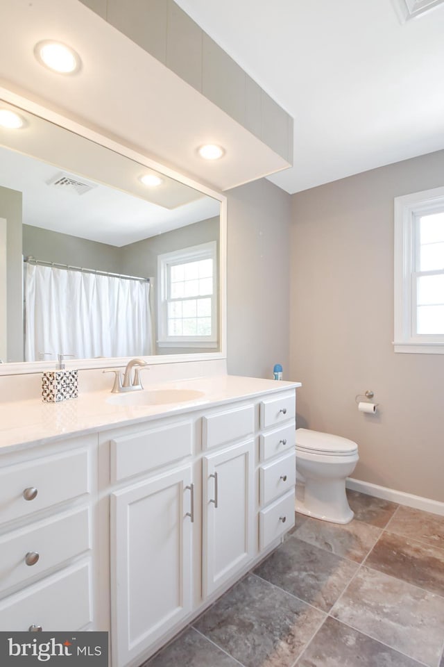 1003 E Cherry St, Palmyra, PA 17078 - full bath featuring vanity, visible vents, recessed lighting, toilet, and baseboards