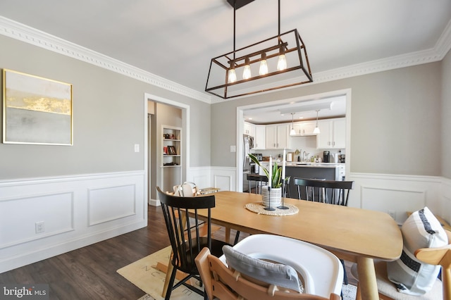 1003 E Cherry St, Palmyra, PA 17078 - dining room featuring crown molding, a decorative wall, dark wood finished floors, and a wainscoted wall