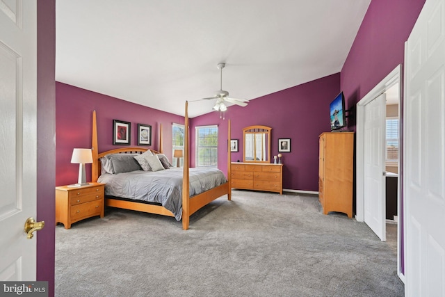 bedroom with ceiling fan, carpet flooring, and vaulted ceiling