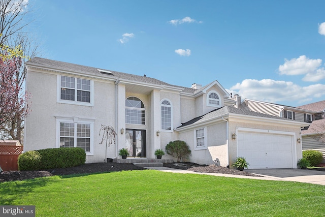 view of front of property with an attached garage, stucco siding, a front lawn, and concrete driveway