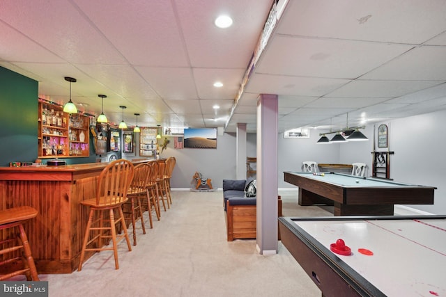 recreation room with baseboards, billiards, a bar, carpet, and a drop ceiling