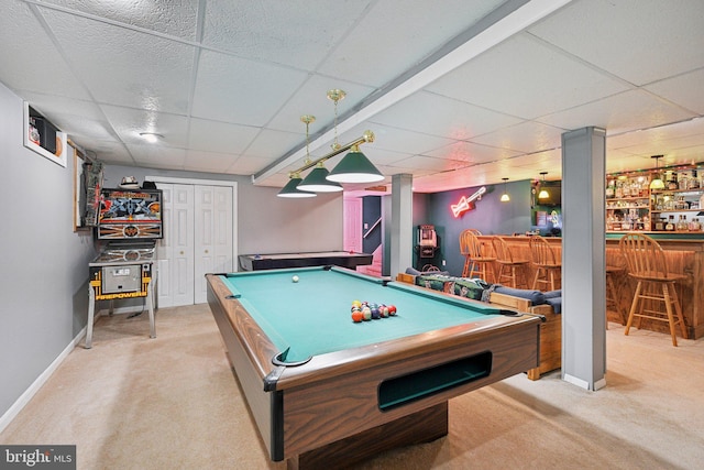 recreation room featuring a bar, billiards, a paneled ceiling, and light carpet