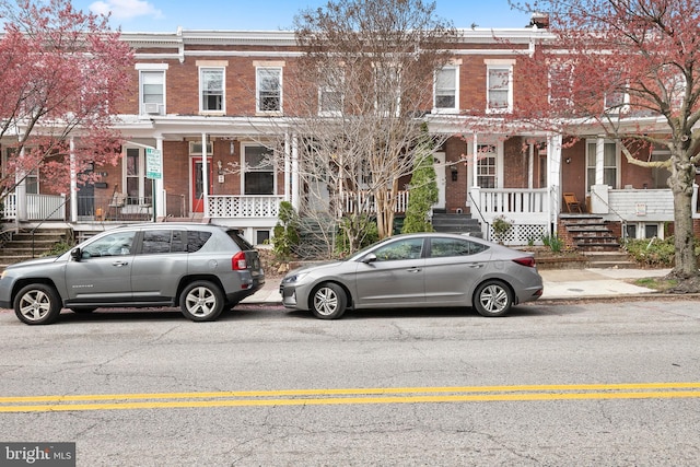 townhome / multi-family property featuring brick siding