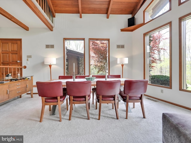 carpeted dining space featuring visible vents and a healthy amount of sunlight