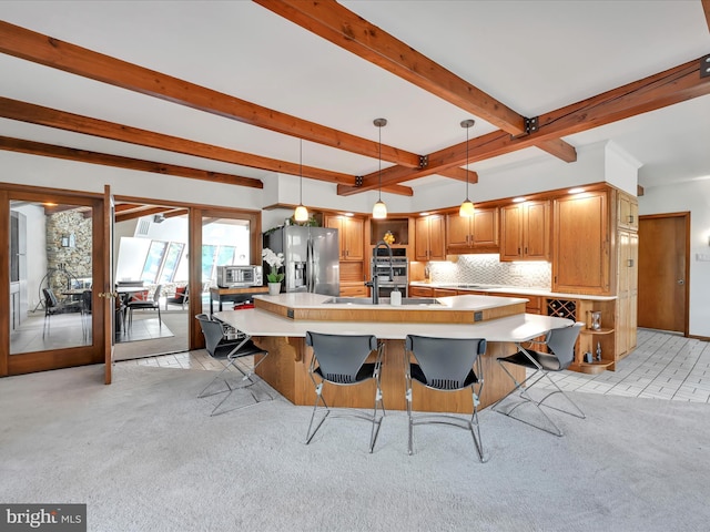 kitchen with stainless steel refrigerator with ice dispenser, light colored carpet, open shelves, light countertops, and beamed ceiling