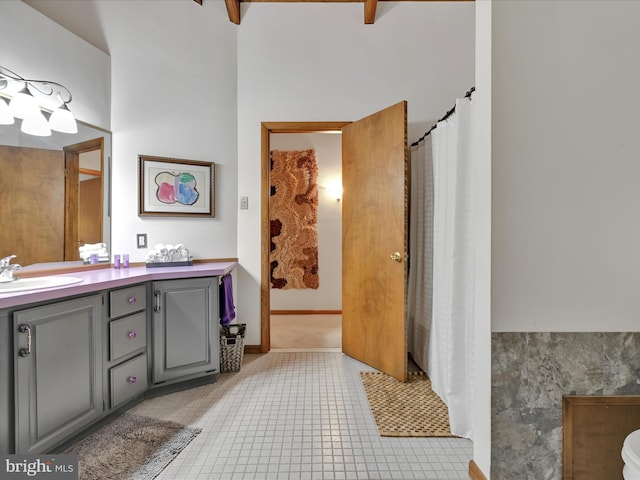 full bathroom with vanity, tile patterned flooring, and a shower with curtain