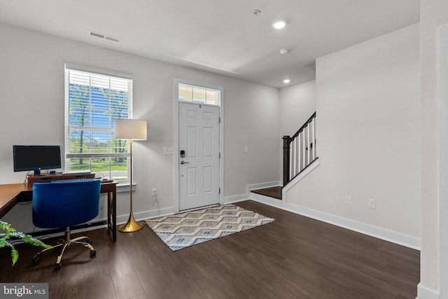 foyer featuring visible vents, wood finished floors, baseboards, stairway, and recessed lighting