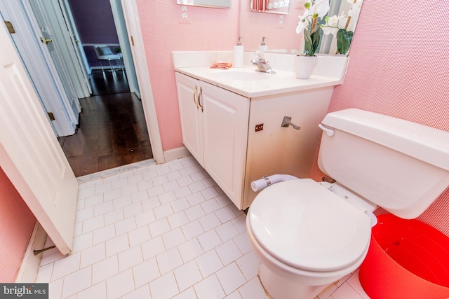 bathroom with tile patterned floors, toilet, and vanity