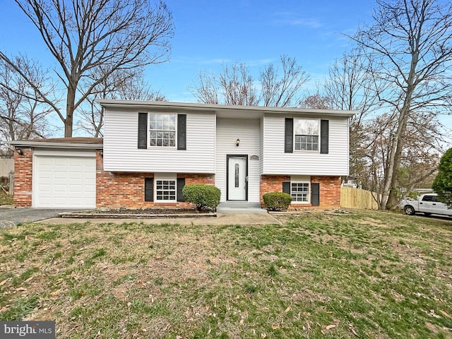 12702 Applecross Dr, Clinton, MD 20735 - raised ranch featuring brick siding, a garage, fence, and a front lawn