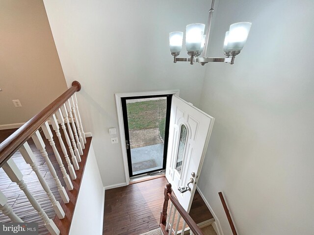 12702 Applecross Dr, Clinton, MD 20735 - foyer featuring a towering ceiling, a notable chandelier, baseboards, and wood finished floors