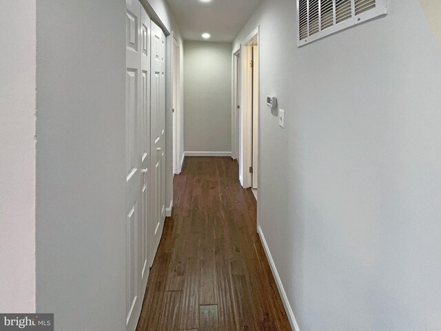12702 Applecross Dr, Clinton, MD 20735 - hall with dark wood-type flooring, baseboards, and visible vents