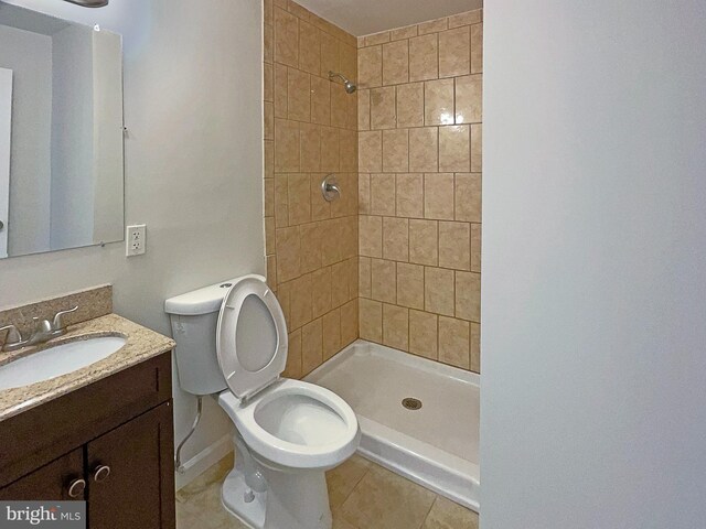 12702 Applecross Dr, Clinton, MD 20735 - bathroom featuring tile patterned floors, a tile shower, toilet, and vanity
