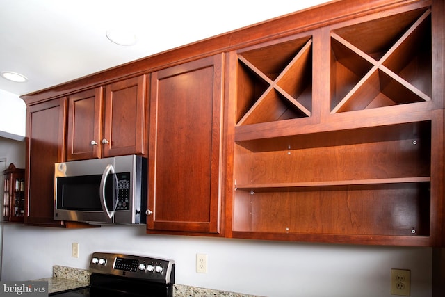 kitchen featuring stainless steel appliances and open shelves