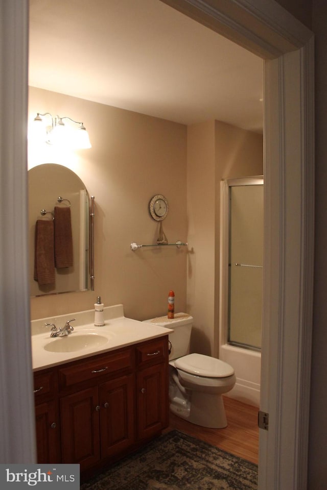 197 Parkwood Dr Unit 320, Chambersburg, PA 17201 - bathroom with enclosed tub / shower combo, wood finished floors, toilet, and vanity
