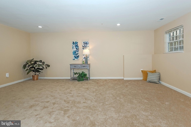 below grade area featuring visible vents, baseboards, carpet, and recessed lighting