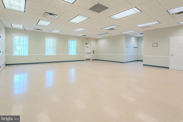 spare room with a paneled ceiling and visible vents