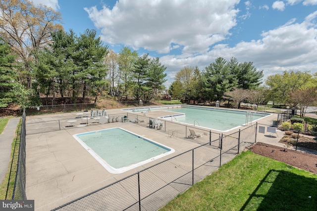 community pool featuring fence