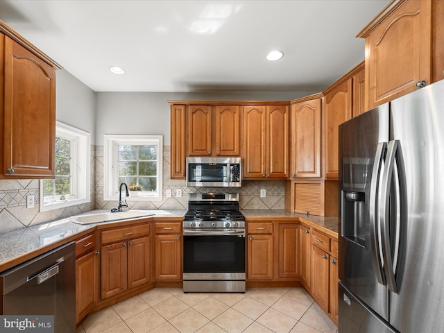 kitchen featuring a sink, brown cabinets, and appliances with stainless steel finishes