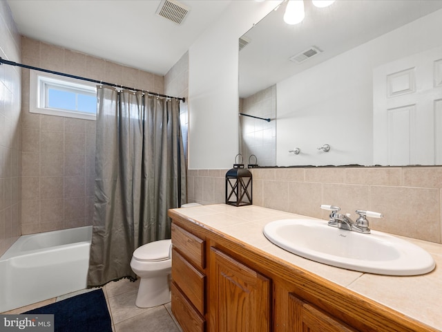 full bath featuring toilet, tile patterned flooring, visible vents, and shower / bathtub combination with curtain