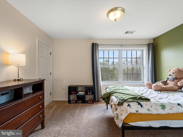 bedroom featuring visible vents, baseboards, and carpet flooring
