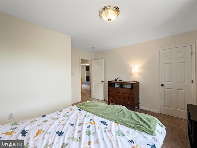 carpeted bedroom with baseboards