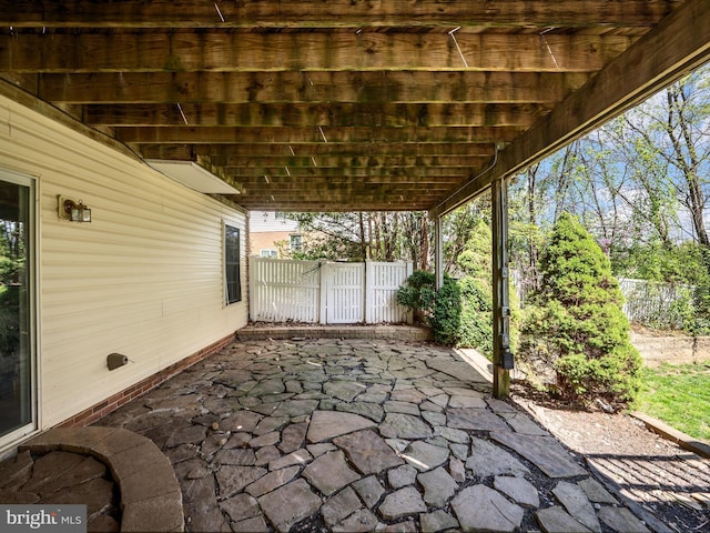 view of patio featuring fence