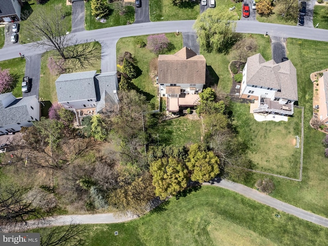 birds eye view of property with a residential view