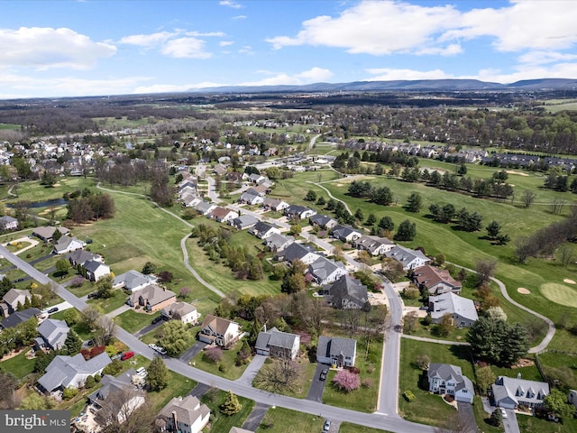drone / aerial view featuring a residential view and a mountain view