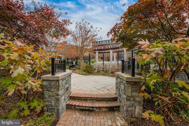exterior space with a patio and fence
