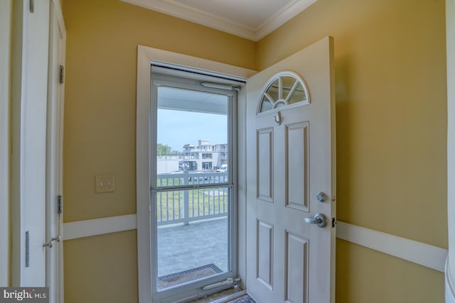 doorway featuring crown molding