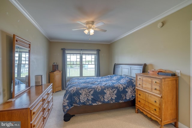 bedroom with crown molding, a ceiling fan, and light colored carpet