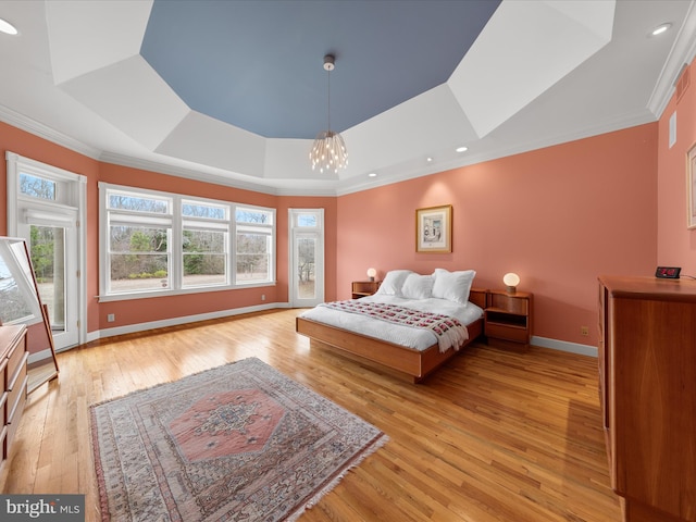 32828 Murray Rd, Frankford, DE 19945 - bedroom featuring a chandelier, crown molding, light wood finished floors, baseboards, and a tray ceiling
