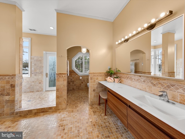 32828 Murray Rd, Frankford, DE 19945 - full bath featuring a healthy amount of sunlight, tile walls, ornamental molding, visible vents, and a walk in shower