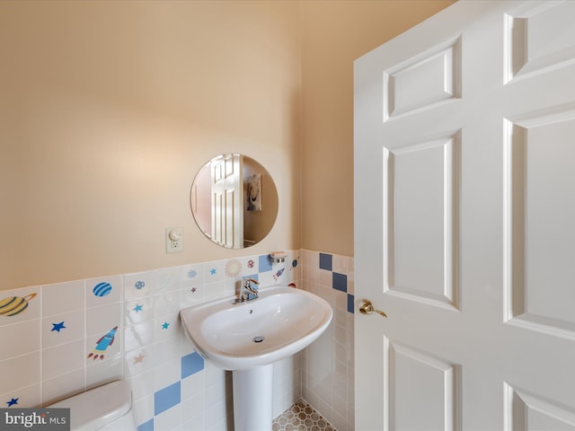 32828 Murray Rd, Frankford, DE 19945 - bathroom featuring a wainscoted wall and tile walls