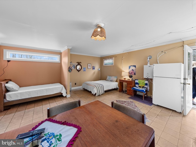 32828 Murray Rd, Frankford, DE 19945 - bedroom featuring multiple windows, ornamental molding, light tile patterned floors, and freestanding refrigerator