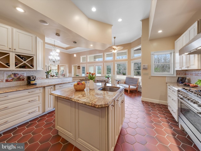 32828 Murray Rd, Frankford, DE 19945 - kitchen with double oven range, tasteful backsplash, recessed lighting, a sink, and light stone countertops
