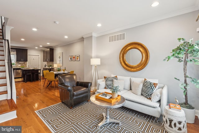 1131 S 26th St, Philadelphia, PA 19146 - living area featuring ornamental molding, stairway, recessed lighting, and light wood-type flooring