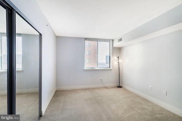 414 Water St Unit 1802, Baltimore, MD 21202 - unfurnished bedroom with baseboards, visible vents, and carpet floors