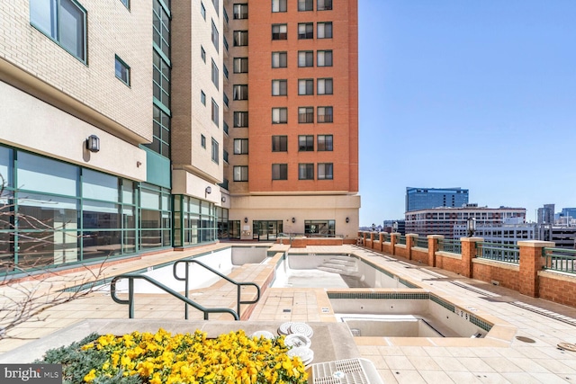 414 Water St Unit 1802, Baltimore, MD 21202 - view of pool featuring a city view and a hot tub