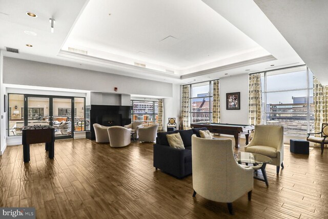 414 Water St Unit 1802, Baltimore, MD 21202 - living room featuring a raised ceiling, wood finished floors, pool table, and visible vents