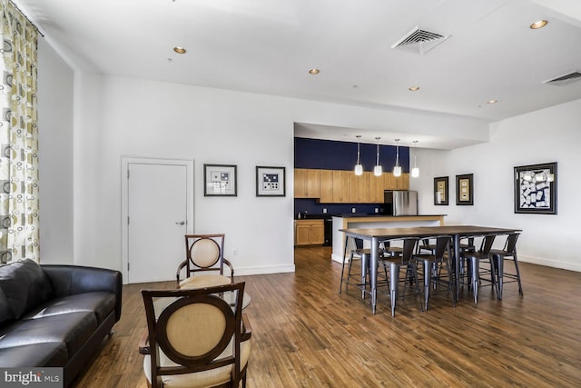 414 Water St Unit 1802, Baltimore, MD 21202 - dining room with dark wood-style floors, baseboards, and visible vents