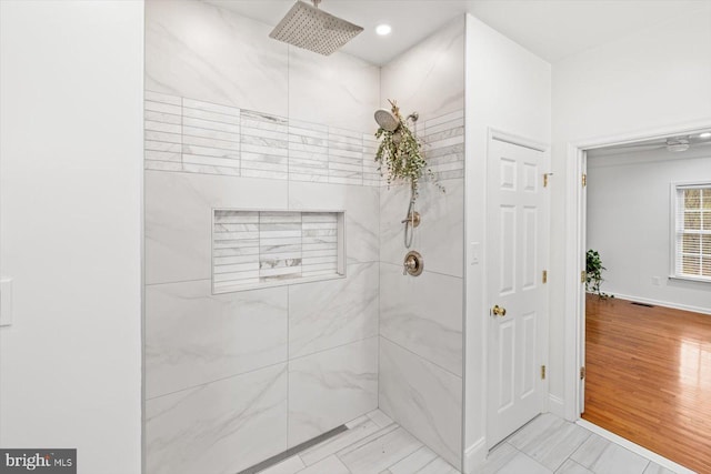 bathroom with recessed lighting, visible vents, baseboards, and a marble finish shower
